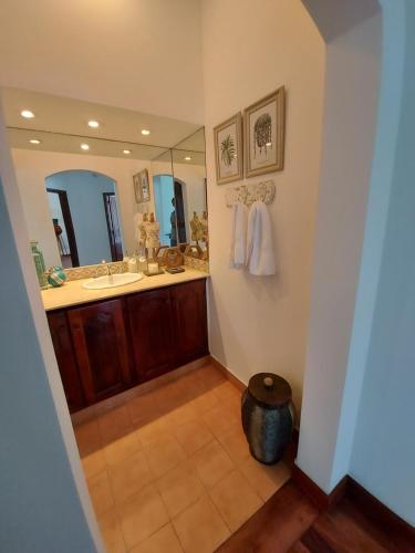 a bathroom with a sink and a mirror at Casa del buen recuerdo San Lorenzo -SALTA- in San Lorenzo