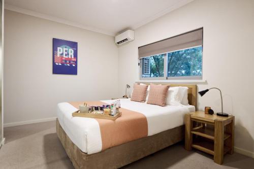 En eller flere senge i et værelse på Airport Apartments by Vetroblu