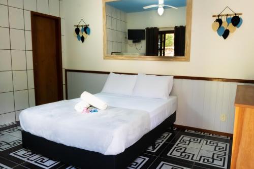Voodi või voodid majutusasutuse Raio de Sol pousada & camping toas