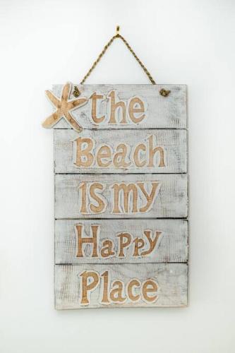 a sign that says the beach is my happy place at Broadbeach Victoria Square in Gold Coast