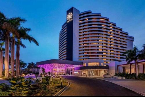a large building with purple lights in front of it at Broadbeach Victoria Square in Gold Coast