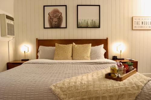 a bedroom with a large bed with two lamps on it at Mid-Century Gem w/King in Park City