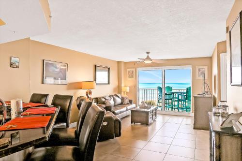 a living room with a couch and a table at Sand and Sea Enjoyment Retreat in Ormond Beach