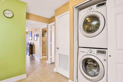 a laundry room with a washer and dryer at Sand and Sea Enjoyment Retreat in Ormond Beach