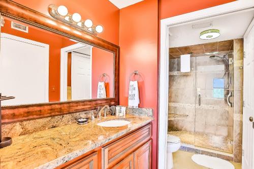 a bathroom with a sink and a shower at Sand and Sea Enjoyment Retreat in Ormond Beach
