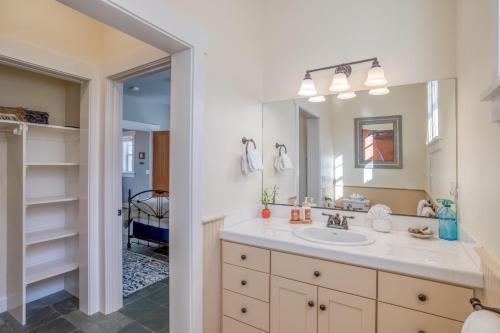 a bathroom with a sink and a mirror at Mill House in Lincoln City