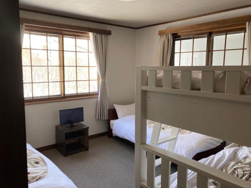 Ένα ή περισσότερα κρεβάτια σε δωμάτιο στο Murmeln