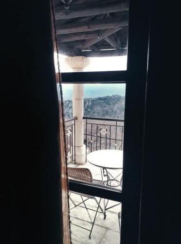 a view from a window of a balcony with a table at Soul boutique hotel in Monodendri