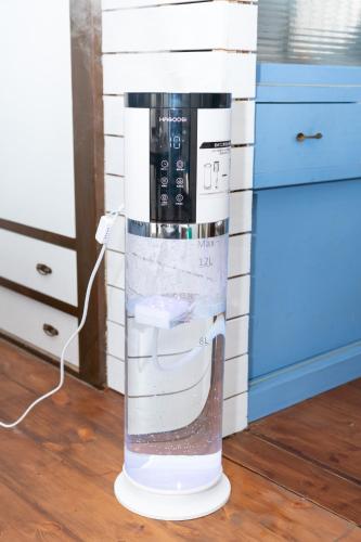 a coffee machine sitting on the floor in a kitchen at Blue Lagoon in Kamakura