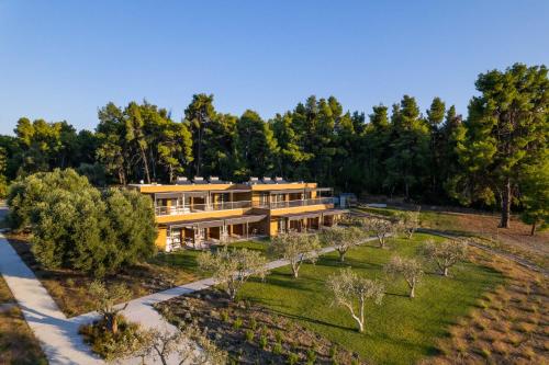 an aerial view of a house with trees at Sani Verde in Sani Beach