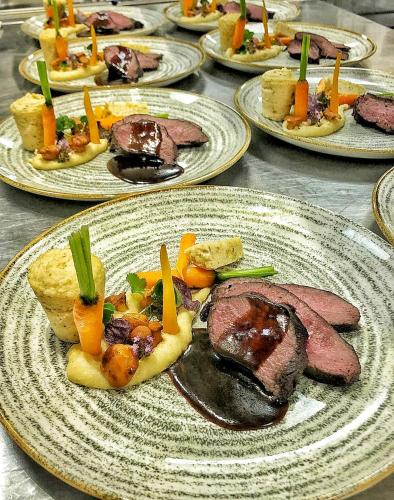 a bunch of plates of food on a table at Hotel Alpina in Rauris