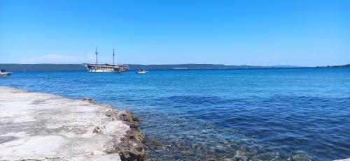 a large body of water with boats in it at Apartments Kornati in Ždrelac