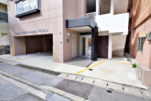 a building that is under construction on a street at TOMMY CONDOMINIUM WAKASA 601 in Naha