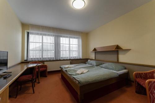 TV a/nebo společenská místnost v ubytování Hotel Amco