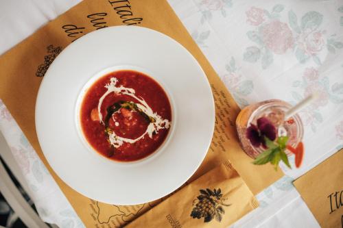 a bowl of tomato sauce on a table at Hotel SLUNEČNÁ LOUKA in Lipno nad Vltavou