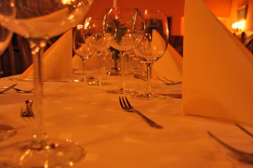a group of wine glasses sitting on a table at Guesthouse Jersin in Logatec