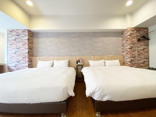 Taichung Old F Hotelにあるベッド