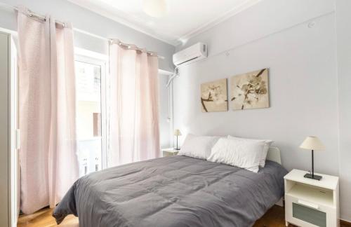 Ένα ή περισσότερα κρεβάτια σε δωμάτιο στο Luxuriously Central Studio in the Heart of Athens