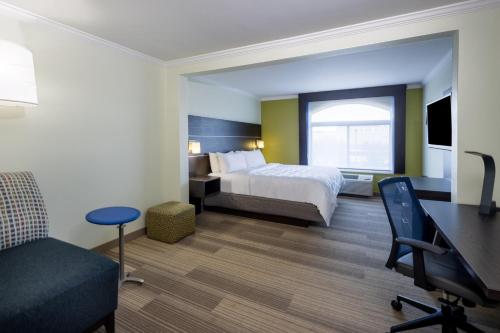 a hotel room with a bed and a desk at Holiday Inn Express - Coventry S - West Warwick Area by IHG in Coventry