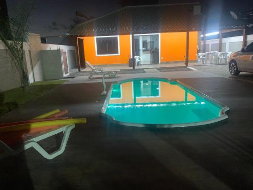a swimming pool in the middle of a parking lot at Faith Home 2 in Arraial do Cabo
