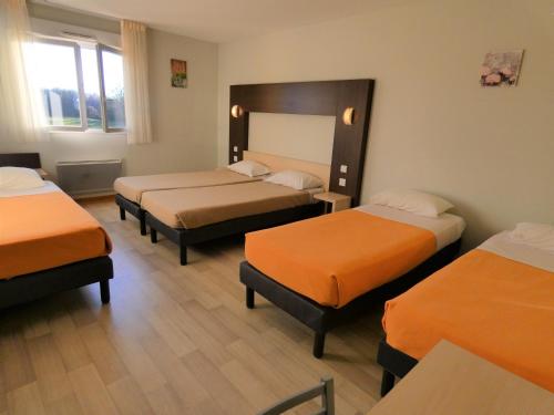 a room with three beds with orange sheets at Hôtel Azur Saint Junien Cit'Hotel in Saint-Junien