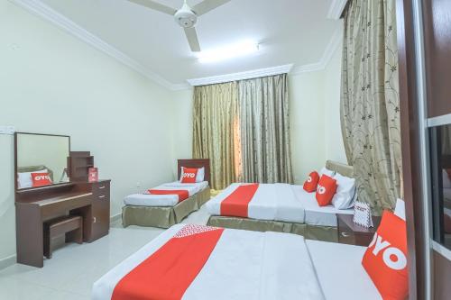 Кровать или кровати в номере Super OYO 111 Al Thabit Hotel