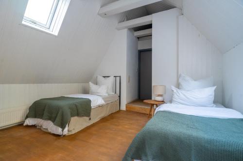a bedroom with two beds and a window at pestahome in Hannover