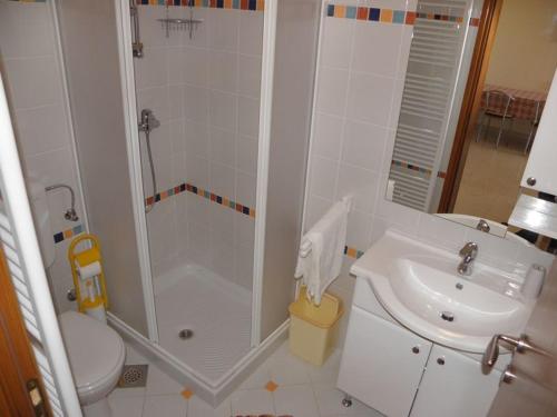 a bathroom with a shower and a toilet and a sink at Apartment in Premantura with terrace, air conditioning, WiFi, washing machine 3352-27 in Premantura