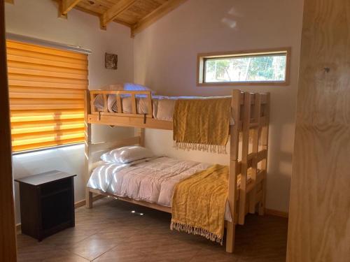 Krevet ili kreveti na kat u jedinici u objektu CABAÑA DE CAMPO