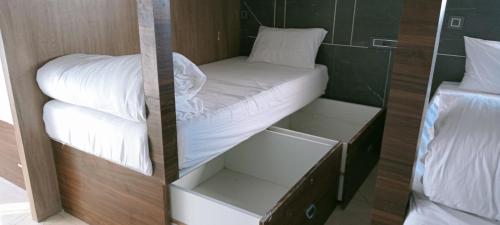a small room with a bed and two bedsitures at Hotel Florence in Nānded