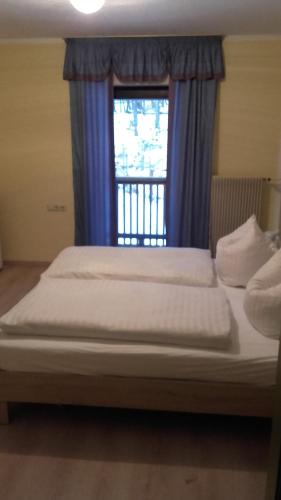 Katil atau katil-katil dalam bilik di Pension Freizeitzentrum Sambachshof