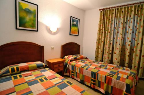 Ένα ή περισσότερα κρεβάτια σε δωμάτιο στο Apartament ARTS 2