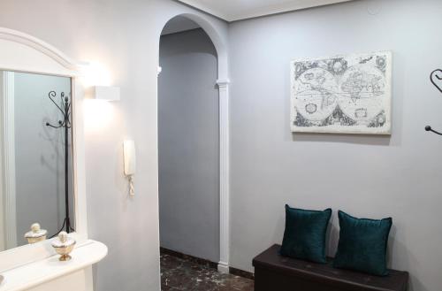 a bathroom with a sink and a mirror at La Corredera in Úbeda