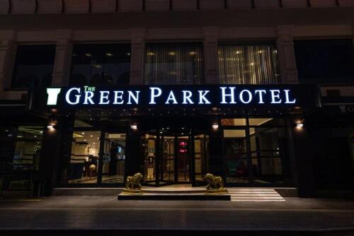 a green park hotel sign in front of a building at The Green Park Diyarbakir in Diyarbakır