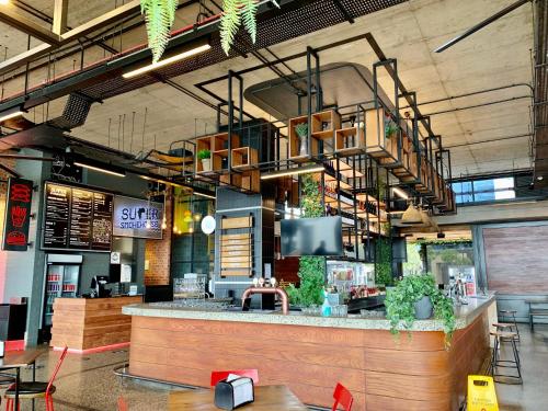 a restaurant with a bar with a tv above it at Umhlanga Arch 703 Sea View self-catering in Durban