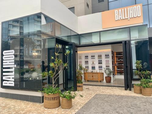 a store front of a building with potted plants at Umhlanga Arch 703 Sea View self-catering in Durban