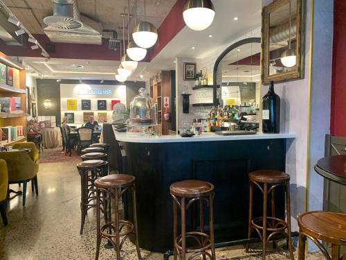 a bar in a restaurant with stools at Umhlanga Arch 703 Sea View self-catering in Durban