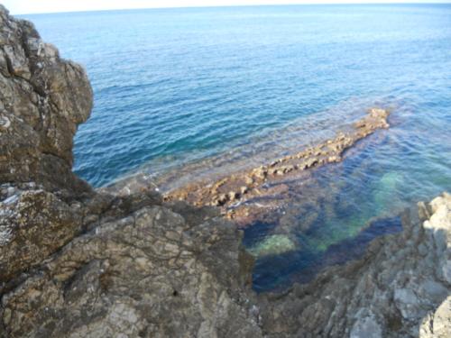 a view of the ocean from a cliff at Terra Sinus Beautiful Suite in Terrasini
