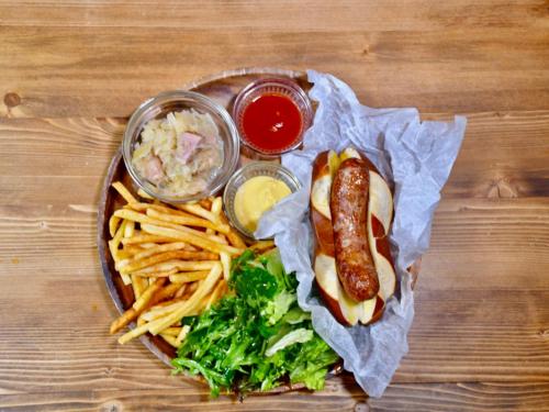 a plate of food with a hot dog and french fries at Marillen Hotel by HHG in Hakuba