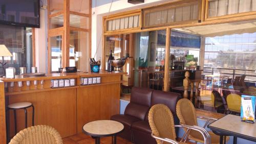 The lounge or bar area at LAS GLORIAS