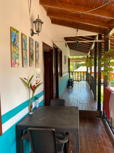 a dining room with a table and chairs at Hotel brisas del pacifico ladrilleros in Ladrilleros