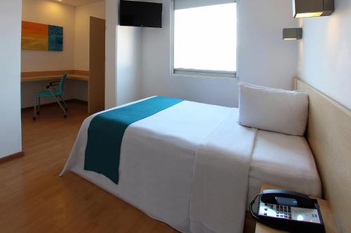 En eller flere senge i et værelse på One Salina Cruz