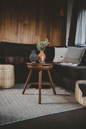 a coffee table with a vase on it in a living room at Svartaborg in Húsavík