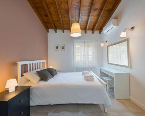מיטה או מיטות בחדר ב-Del Conte