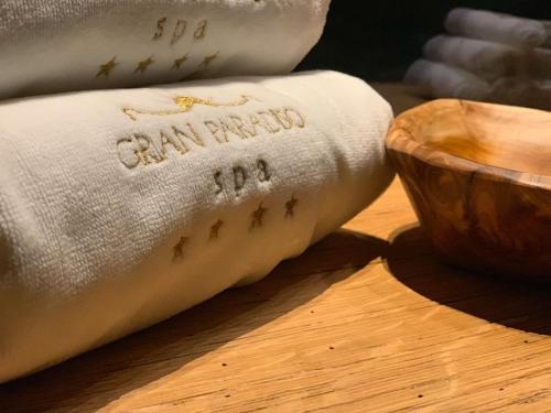 a towel with the words california on it next to a bowl at Gran Paradiso Hotel Spa in San Giovanni Rotondo