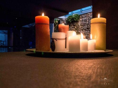a group of candles sitting on a table at Gran Paradiso Hotel Spa in San Giovanni Rotondo
