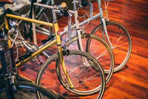 three bikes parked next to each other on a wooden floor at Me and All Hotel Dusseldorf, by Hyatt in Düsseldorf