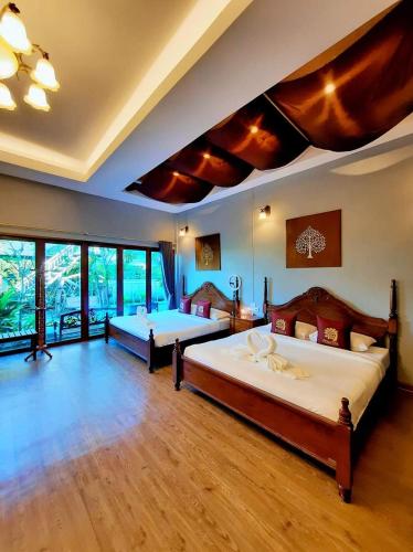 Ένα ή περισσότερα κρεβάτια σε δωμάτιο στο Amantra homestay & village