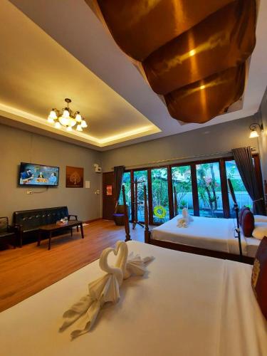 Ένα ή περισσότερα κρεβάτια σε δωμάτιο στο Amantra homestay & village