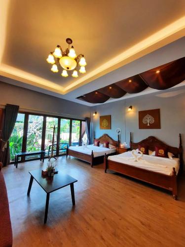 Ένα ή περισσότερα κρεβάτια σε δωμάτιο στο Amantra homestay & village